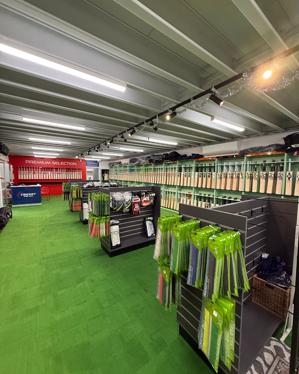 Wide view of the expanded Cricket For All store, with cricket bats and equipment displays